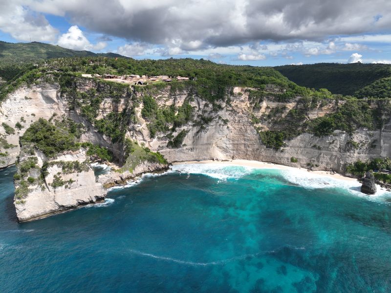 Cliffs and turquoise water on a Nusa Dua beach