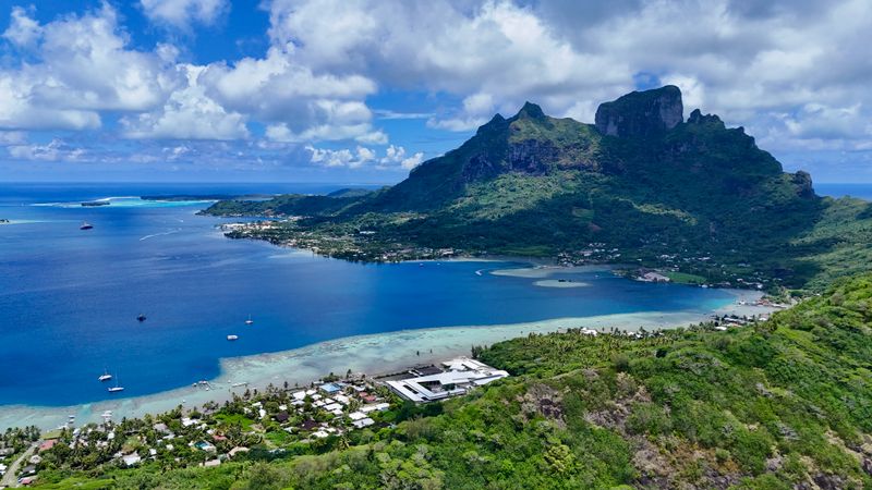 Bora Bora lagoon and green peaks from the air