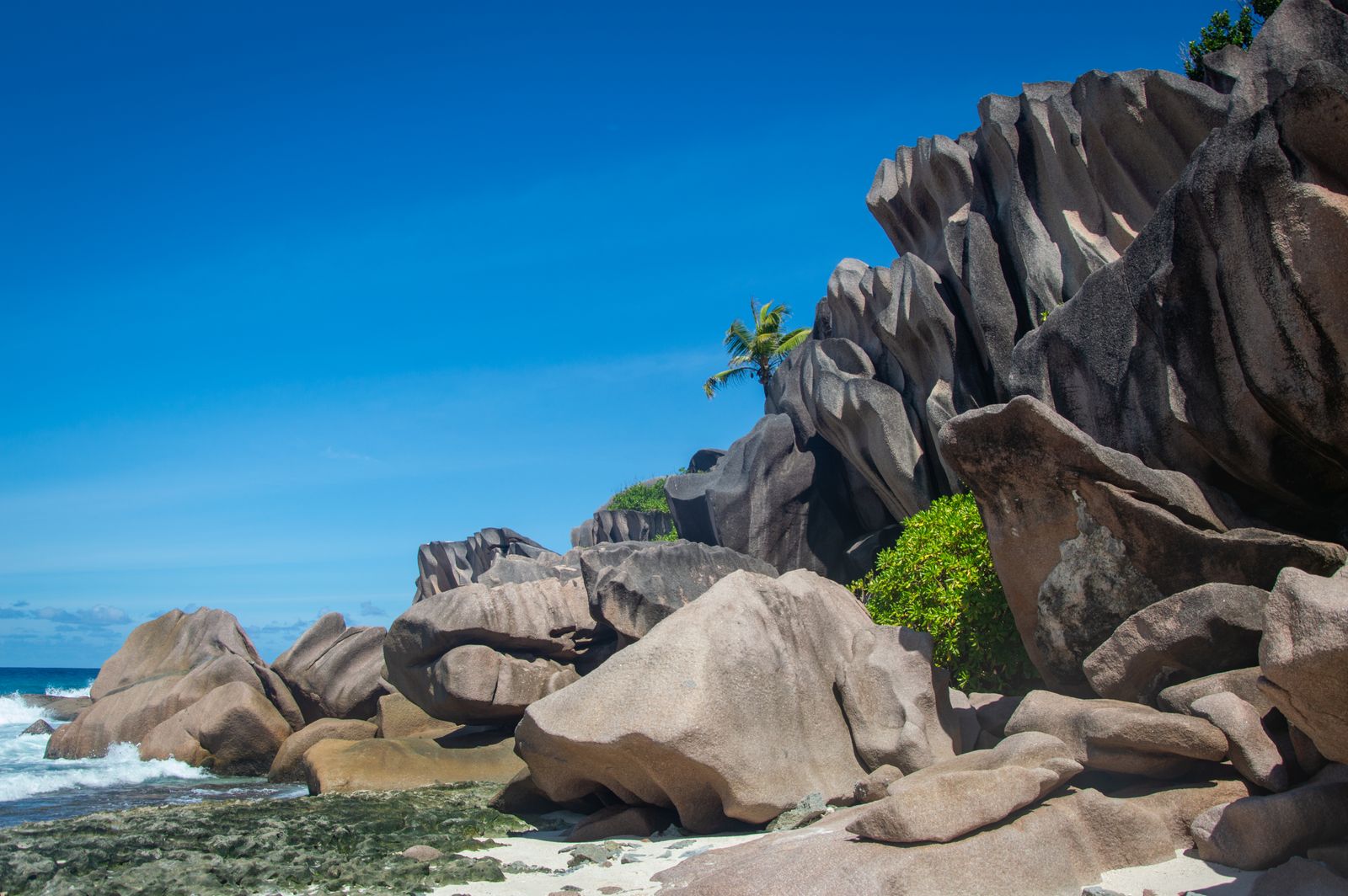 Seychelles granite boulders on white sand