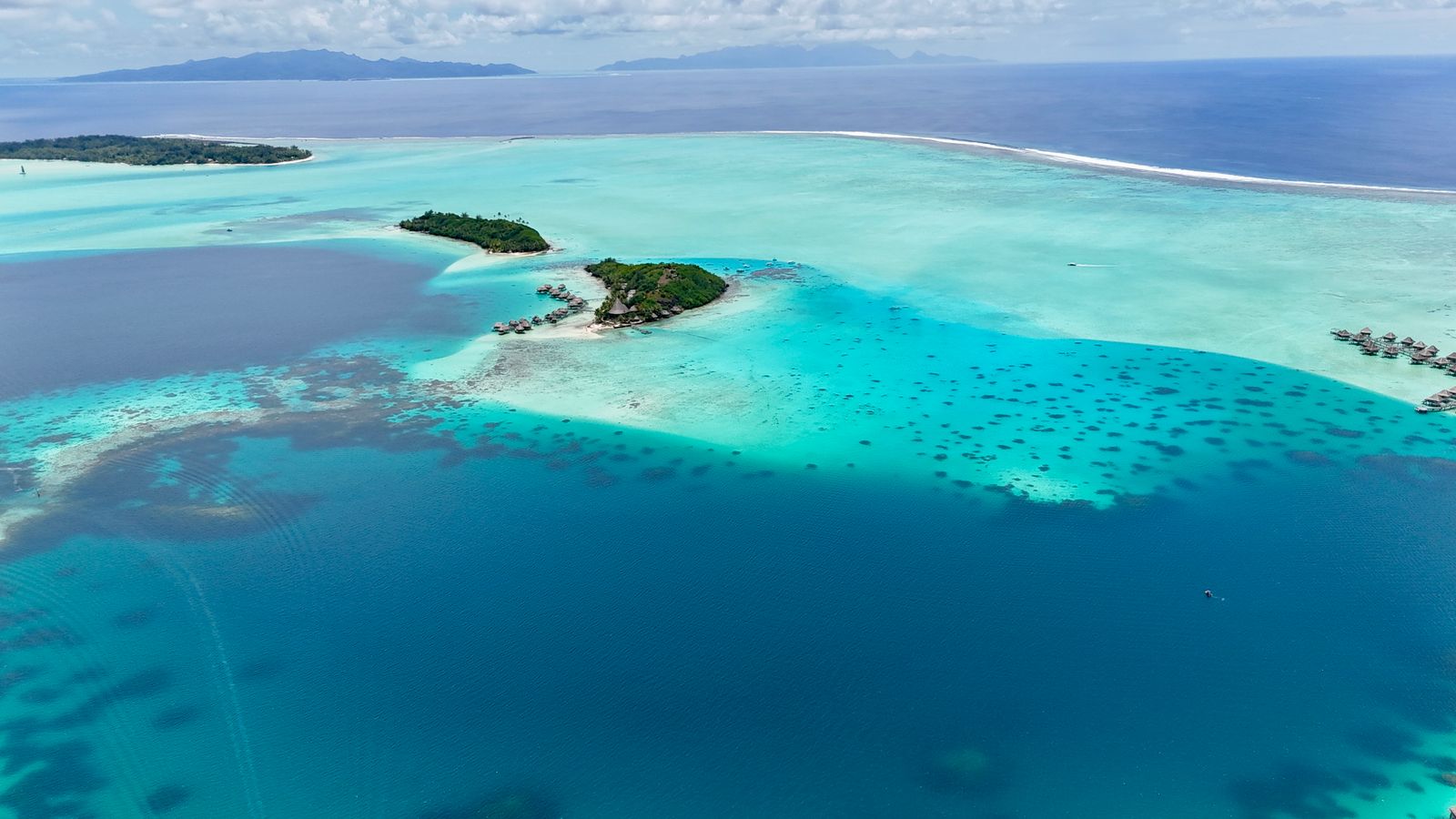 Bora Bora aerial lagoon and green motu