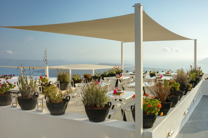 Rooftop dining terrace with a sea view in Santorini
