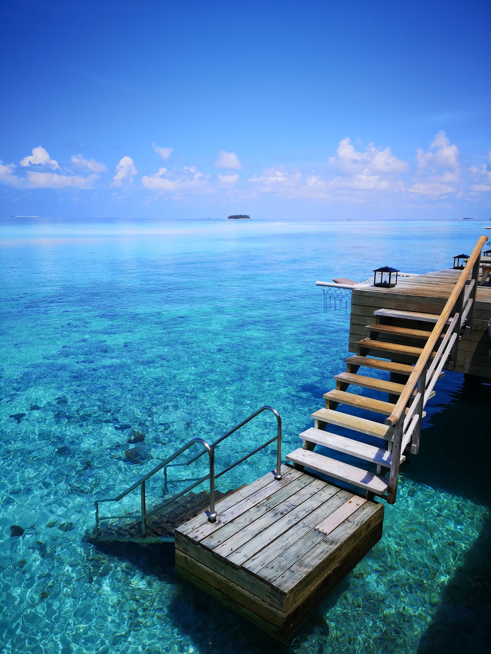 Maldives villa deck steps into lagoon